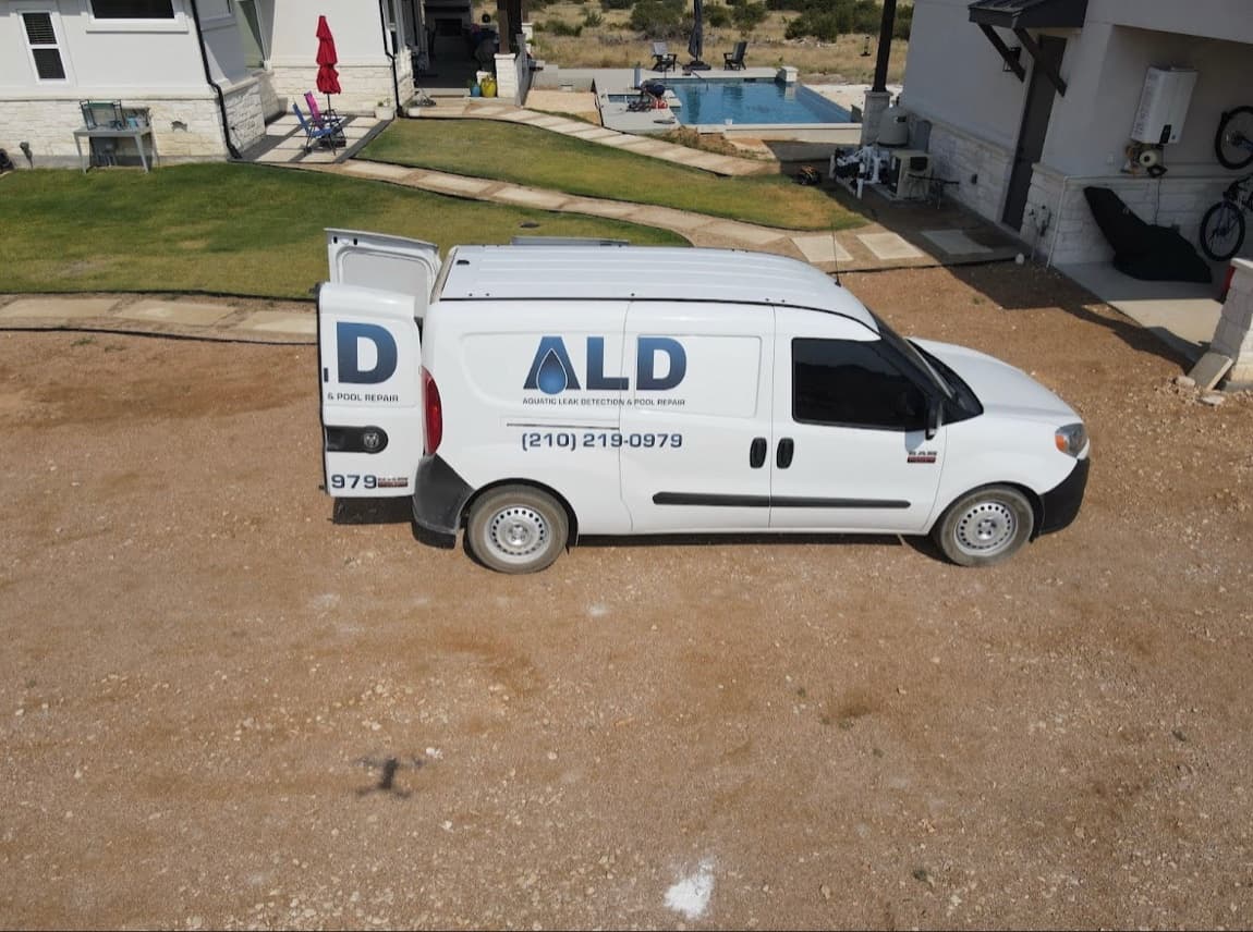 Branded Aquatic Leak Detection & Pool Repair service van at a Texas pool